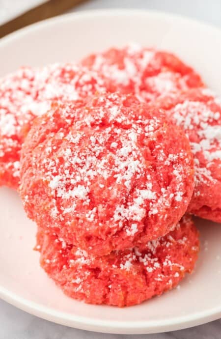 A plate of raspberry gooey cookies on the table.