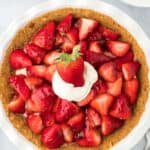 Strawberry Tart on a white background with berries in the background