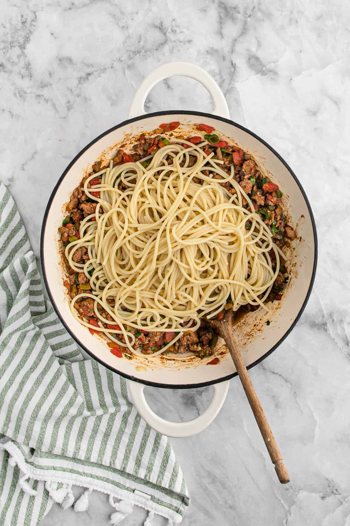 Cooked spaghetti noodles added to the taco meat mixture.