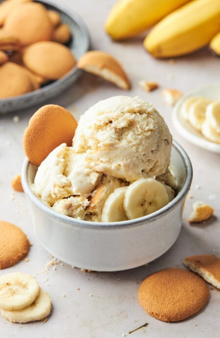 Scoops of banana pudding ice cream in a white bowl