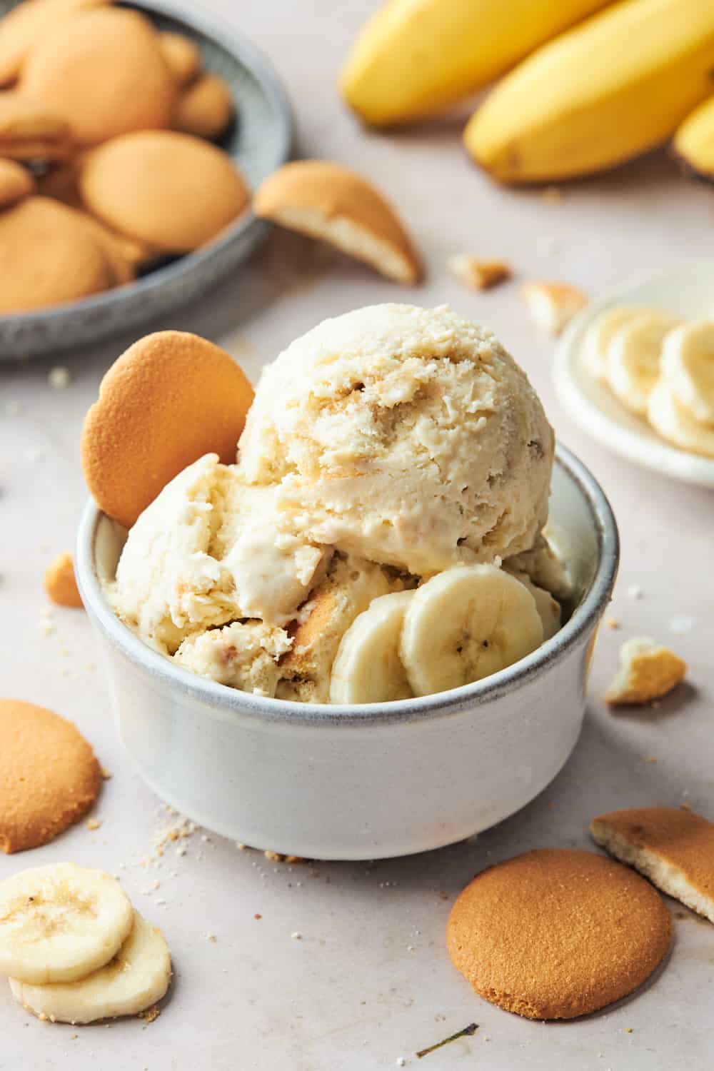 Scoops of banana pudding ice cream in a white bowl