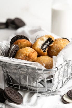 A basket filled with fried oreos ready to serve