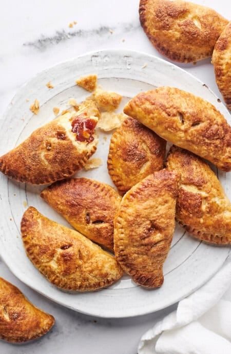 Several guava empanadas on a white plate