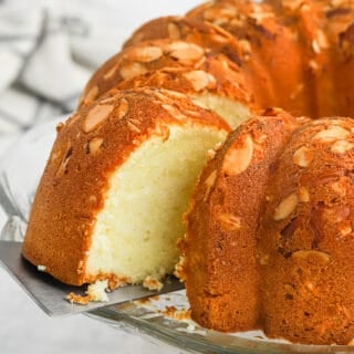 Taking a slice out of the pound cake.