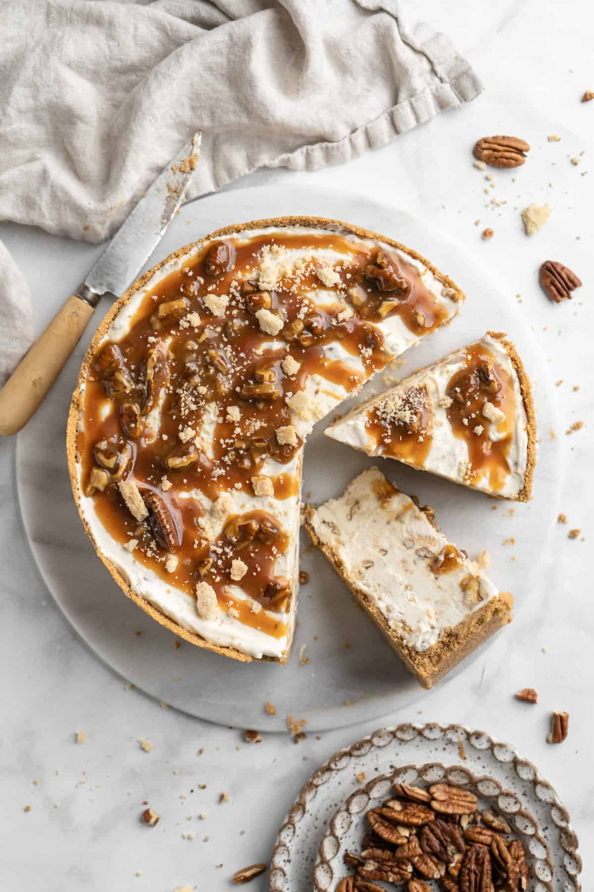 Top view of a pecan pie ice cream pie being sliced.