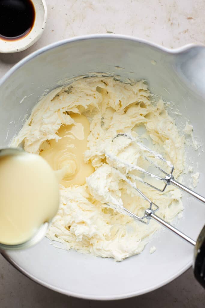 Cream cheese being whipped with condensed milk