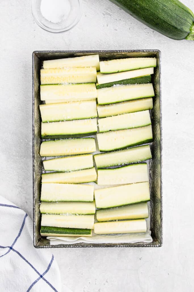 Sliced zucchini drying in a pan.