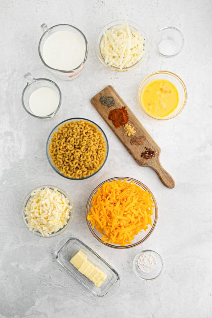 All the ingredients to make Baked Macaroni and Cheese on a countertop