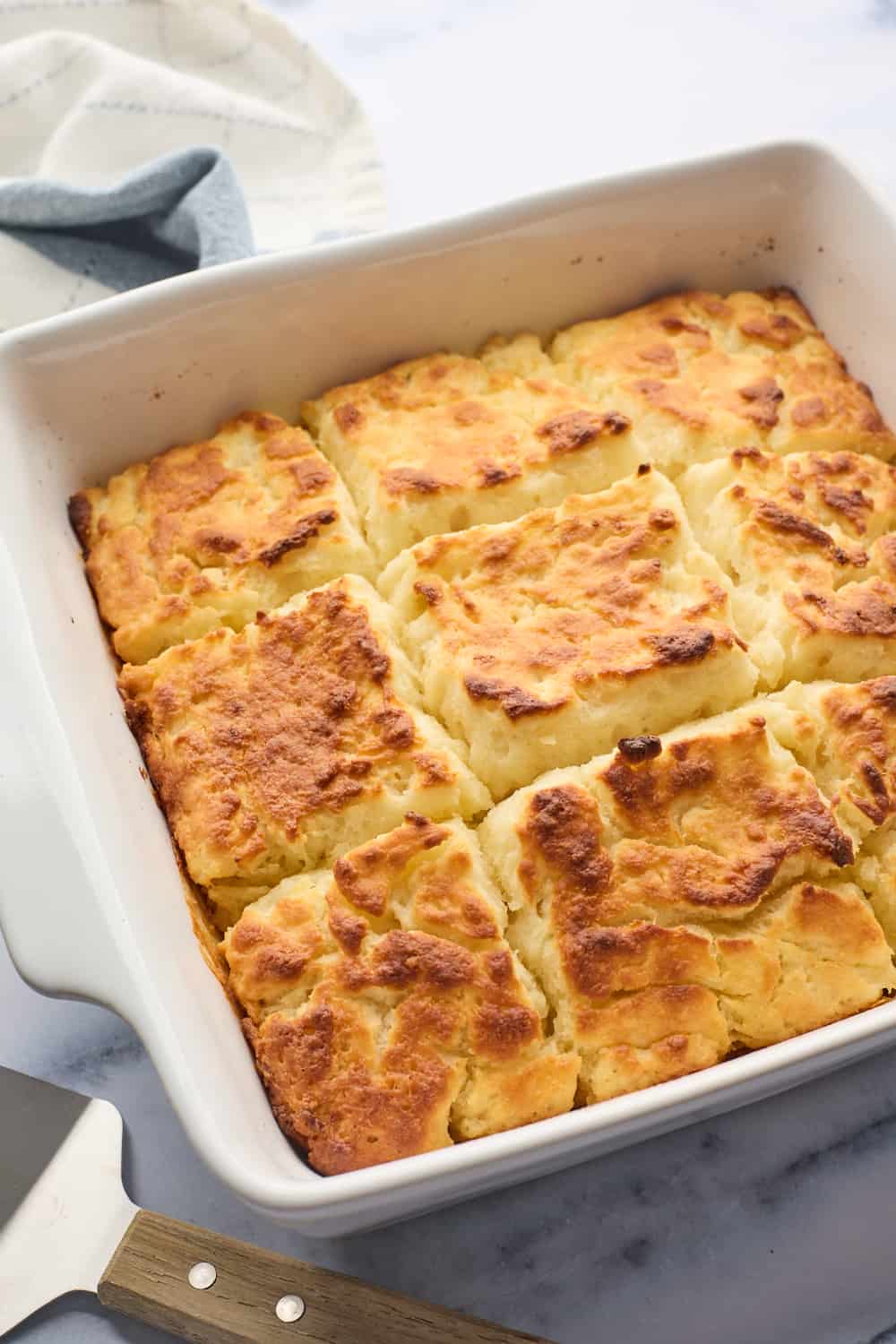 A full pan of butter swim biscuits fresh out of the oven after baking.
