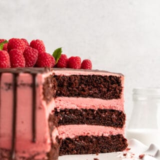 side angle of the inside of a three layer chocolate raspberry cake