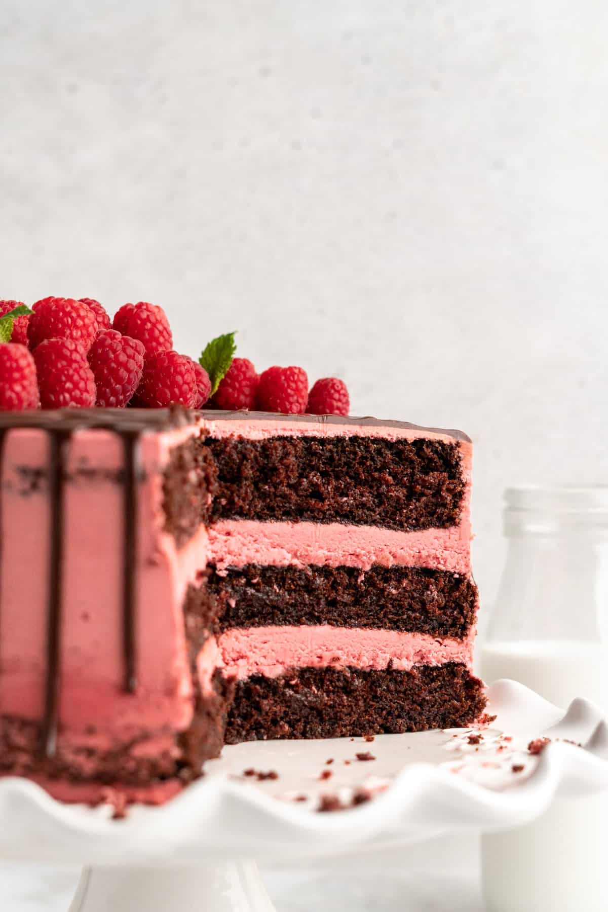 side angle of the inside of a three layer chocolate raspberry cake