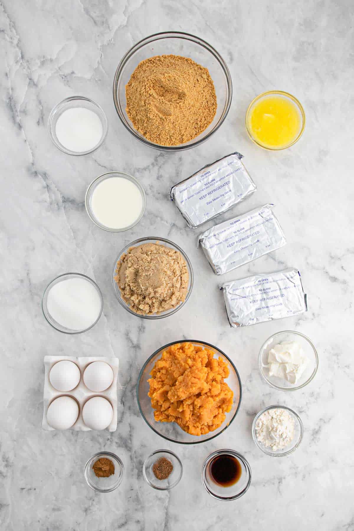 Ingredients to make sweet potato cheesecake on the table ready to mix up.