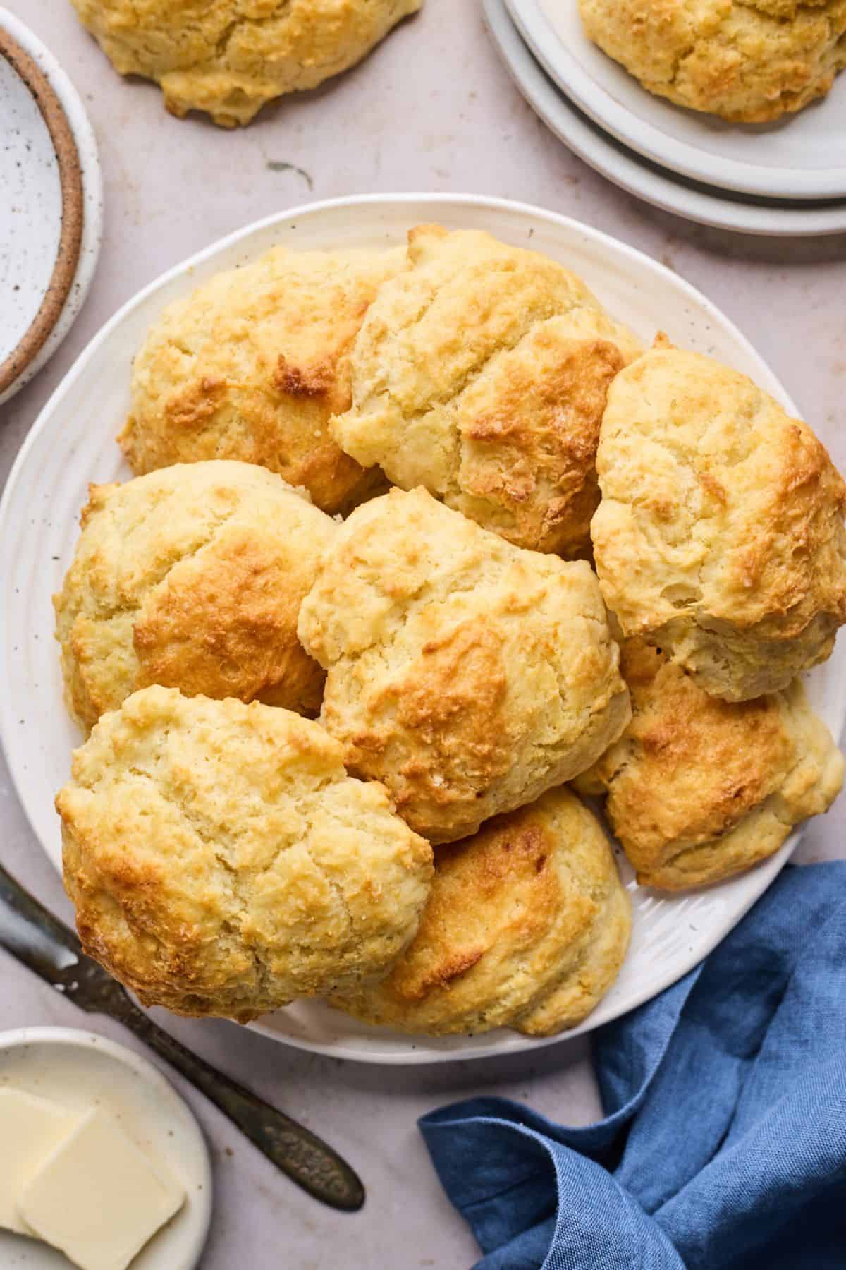 Pile of drop biscuits on a white plate
