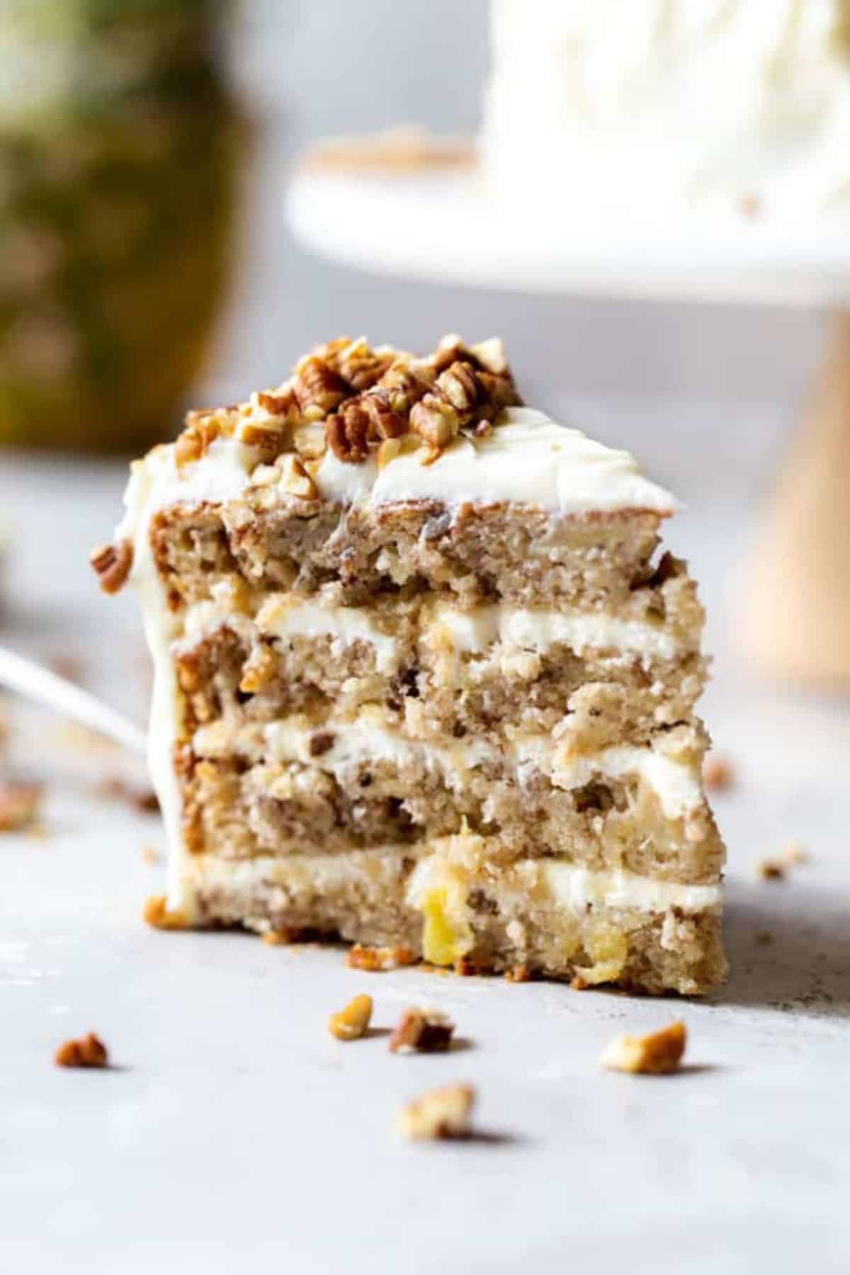 A slice of Southern hummingbird cake on white background ready to enjoy