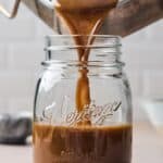 best au jus recipe being poured in a glass jar