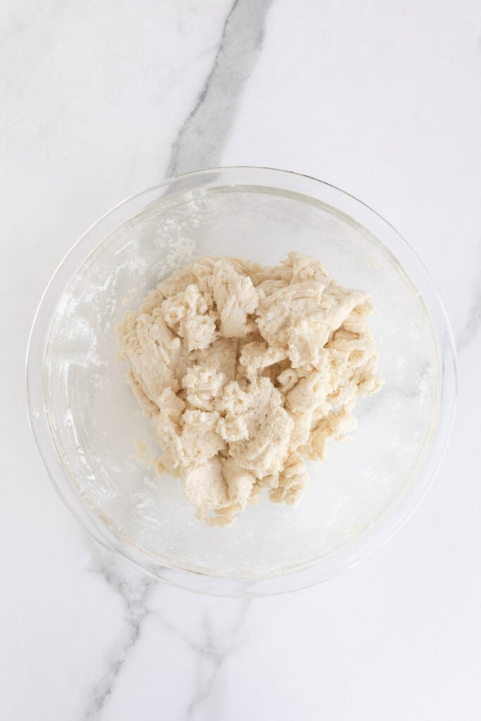 Biscuit dough in a glass bowl after combining