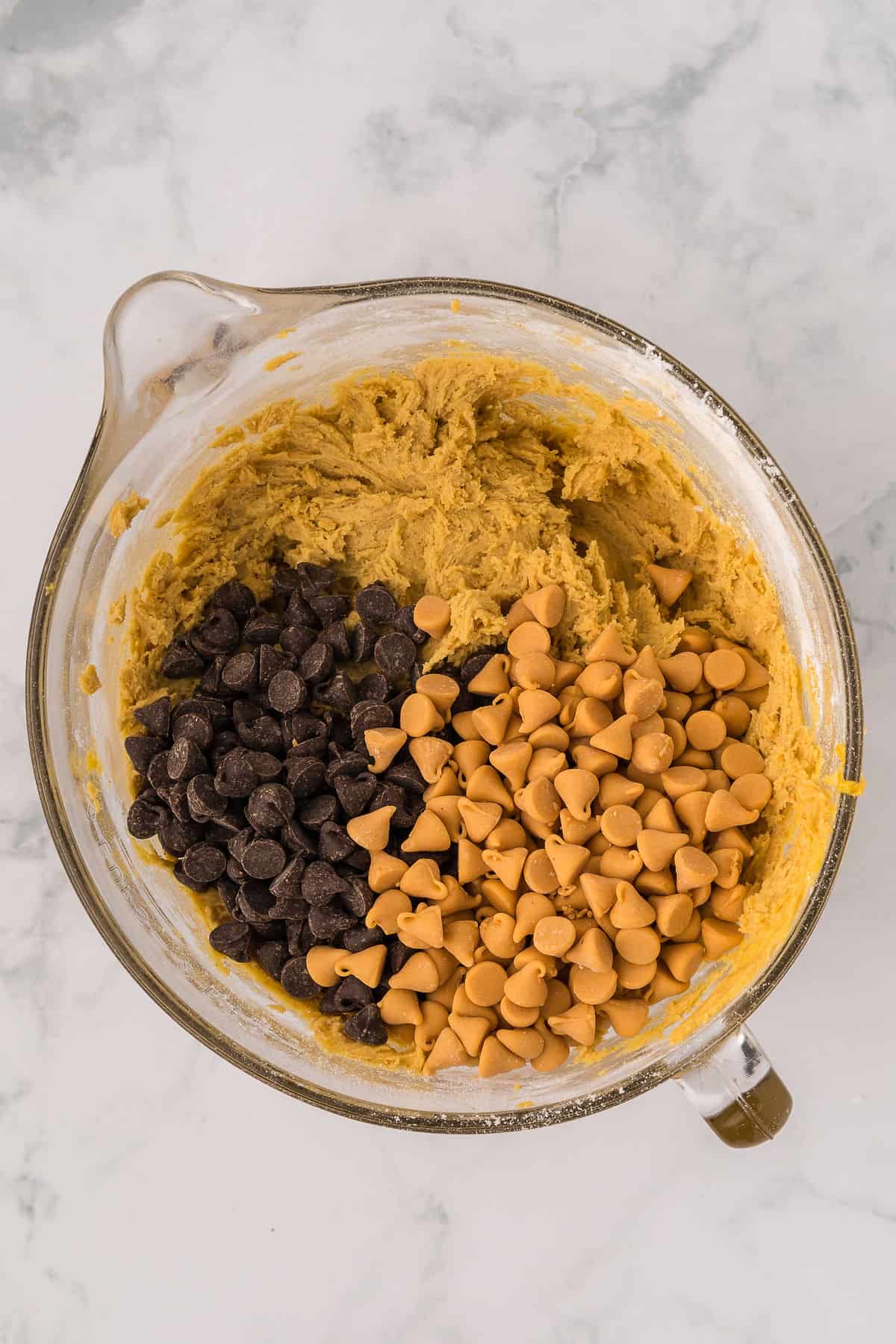 Chocolate and butterscotch chips tossed into cookie batter before mixing up