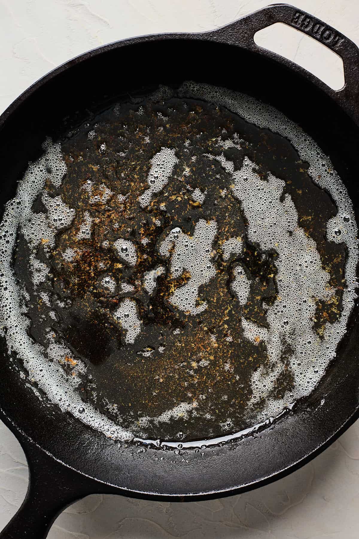 Brown butter in a cast iron skillet foaming