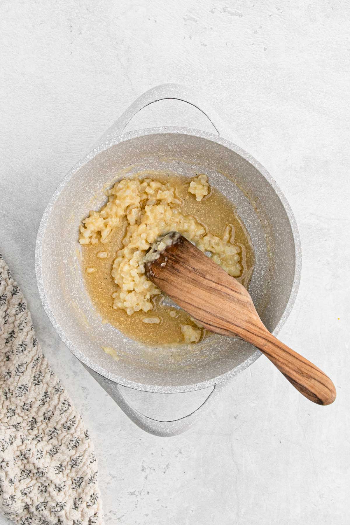 Roux thickening as it cooks, starting to turn golden