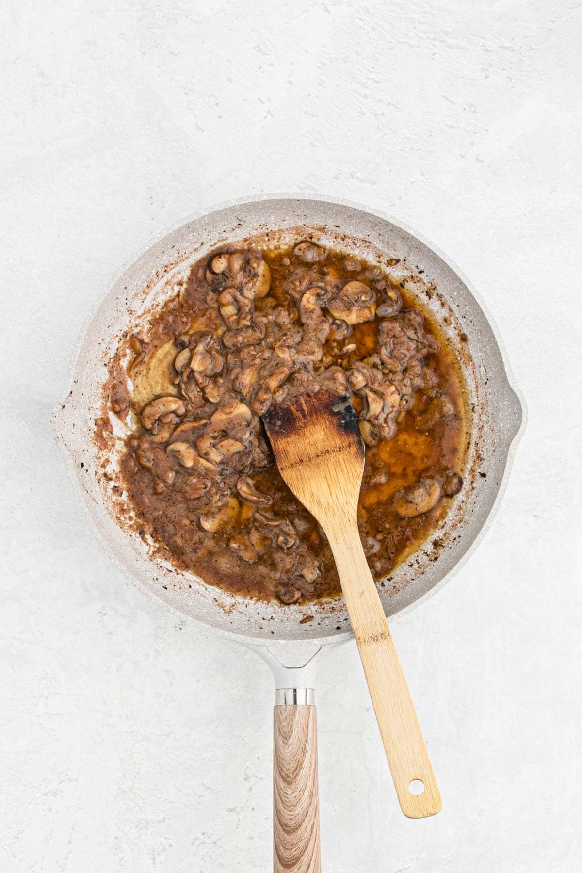 Mushrooms and onions stirred with red wine and flour to form the base of the gravy