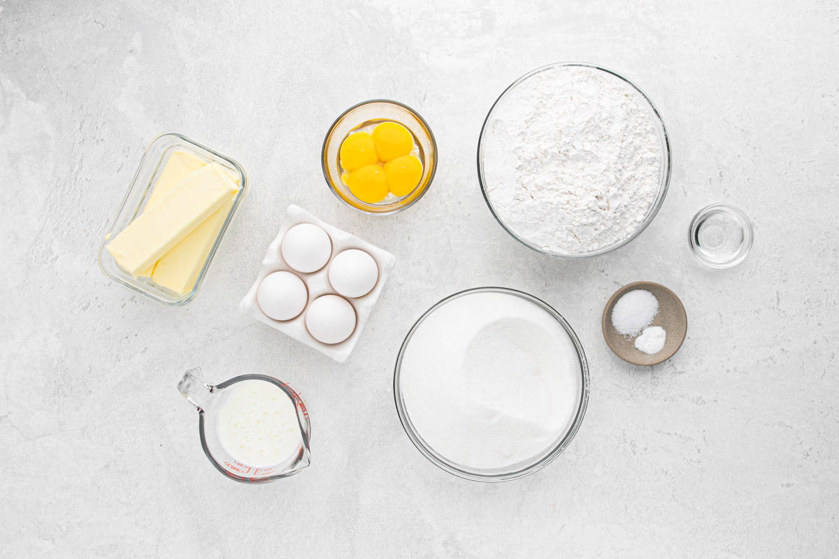 Ingredients to make the buttermilk pound cake on a white surface