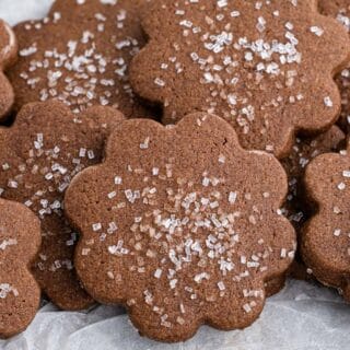 Closeup of chocolate sugar cookies sitting on parchment paper