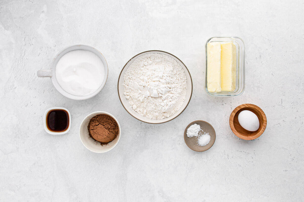 Ingredients to make chocolate sugar cookies on the table before mixing