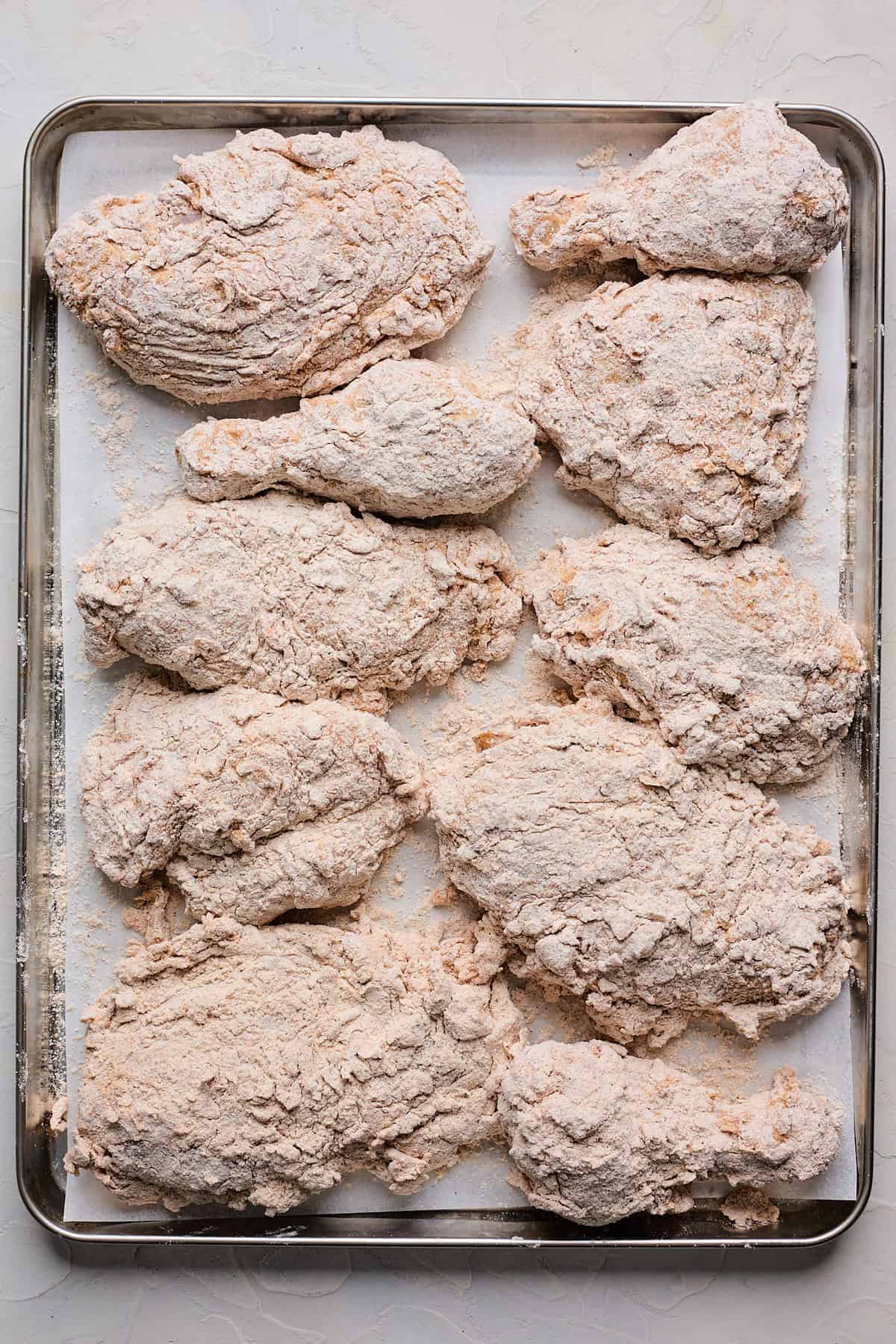 Breaded chicken on a baking sheet