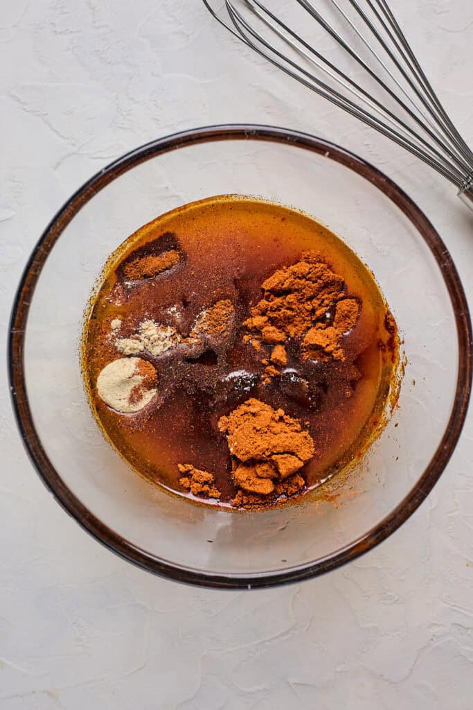 Spices in an oil before coating Nashville hot chicken