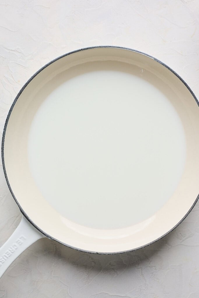 Milk added to a large skillet