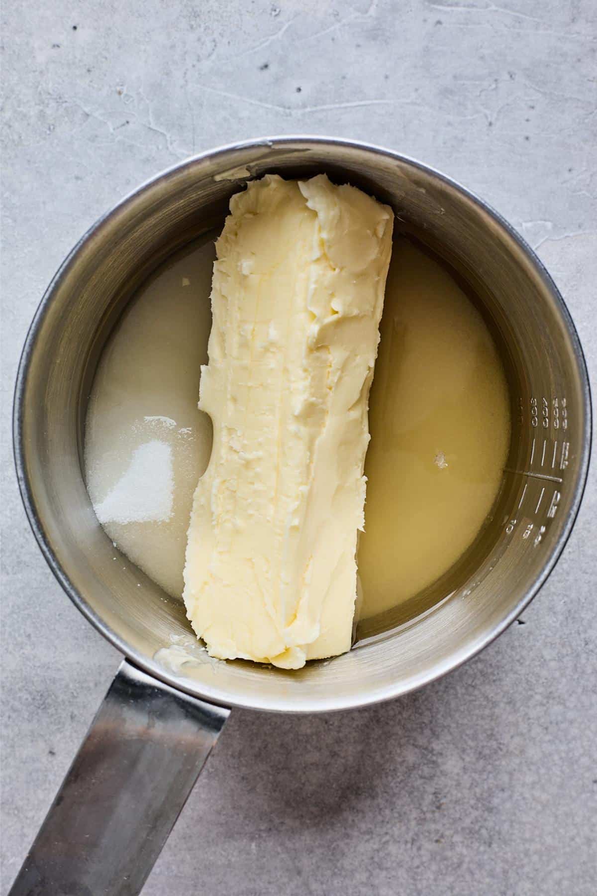 Butter and sugar melting together in a saucepan