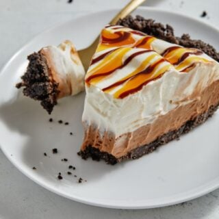 A slice of chocolate mousse pie cut into with a fork