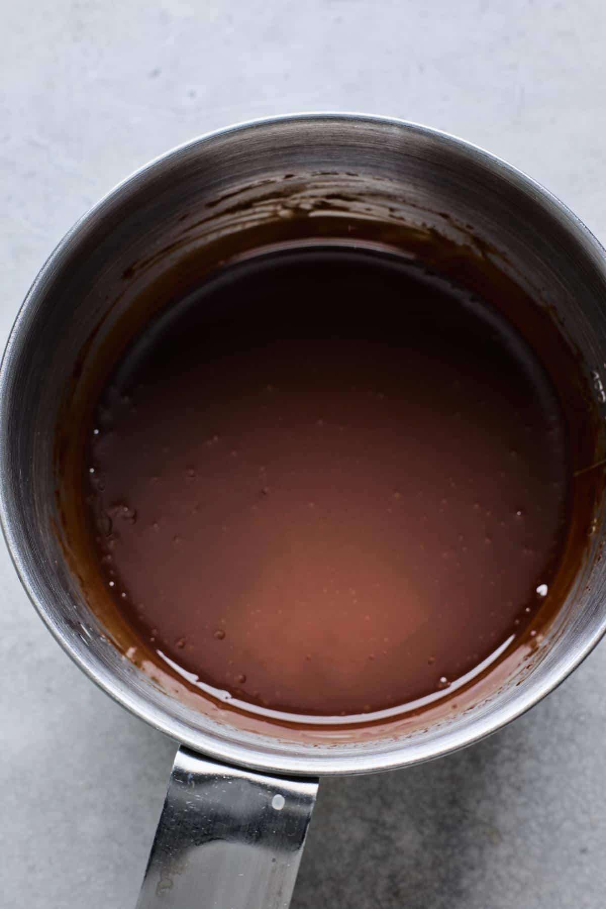 Smooth, glossy chocolate ganache in the saucepan after mixing