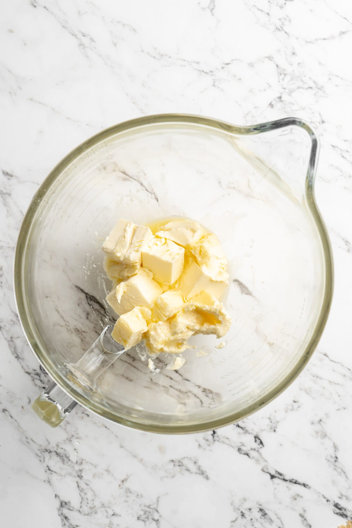 Butter added to a stand mixer bowl before mixing