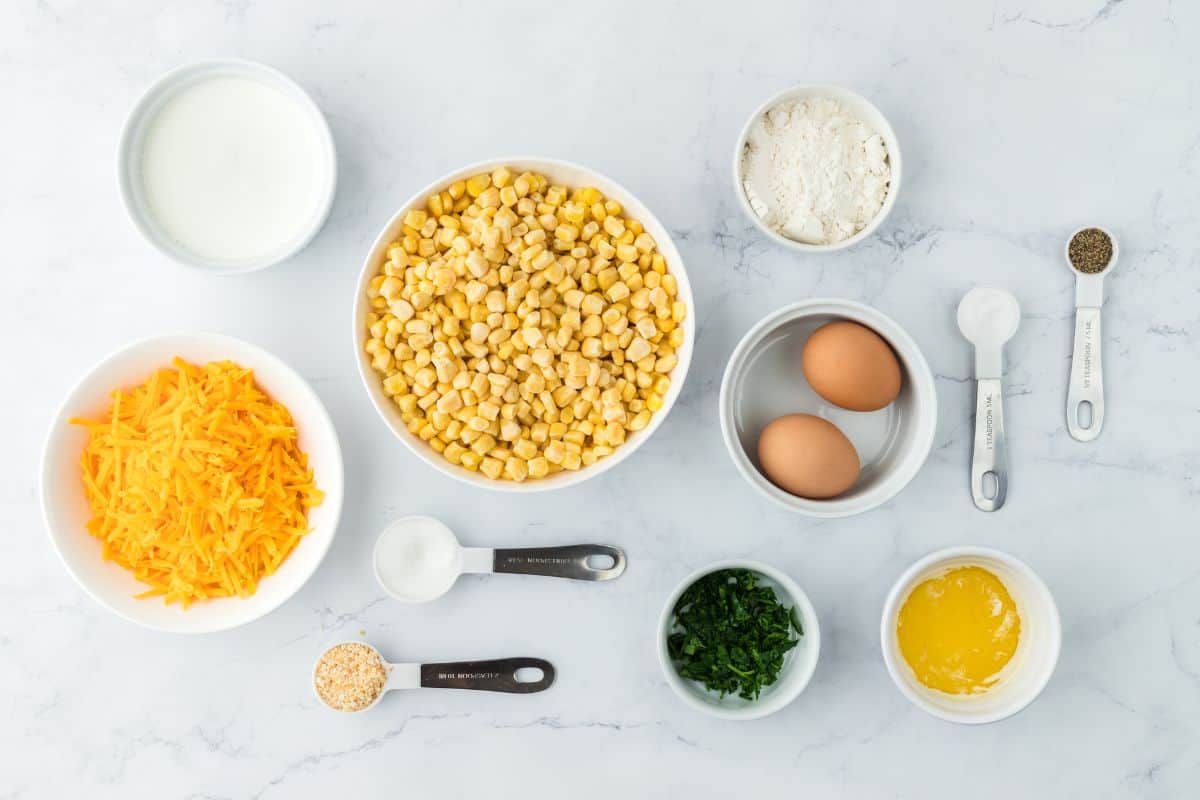 Overhead shot of ingredients to make scalloped corn on the counter before mixing together