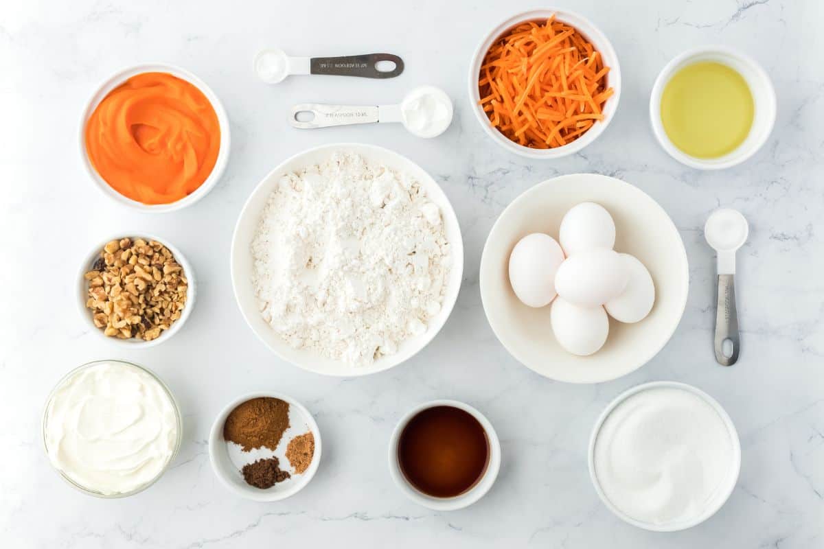 Ingredients to make carrot cake bars on the table before mixing.