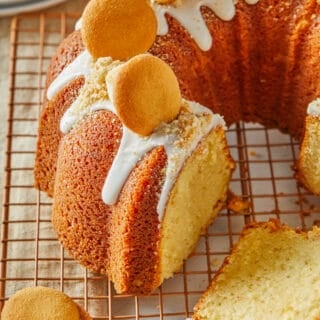A close up of a banana pudding pound cake sliced and ready to serve