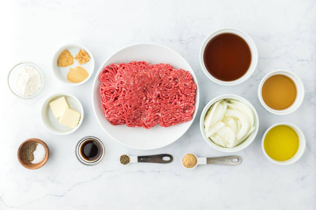 Overhead shot of ingredients to make hamburger steak on the table before mixing and cooking