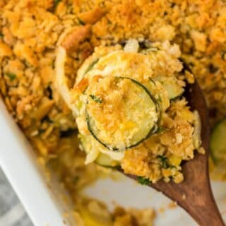 Squash casserole on a wooden spoon ready to enjoy