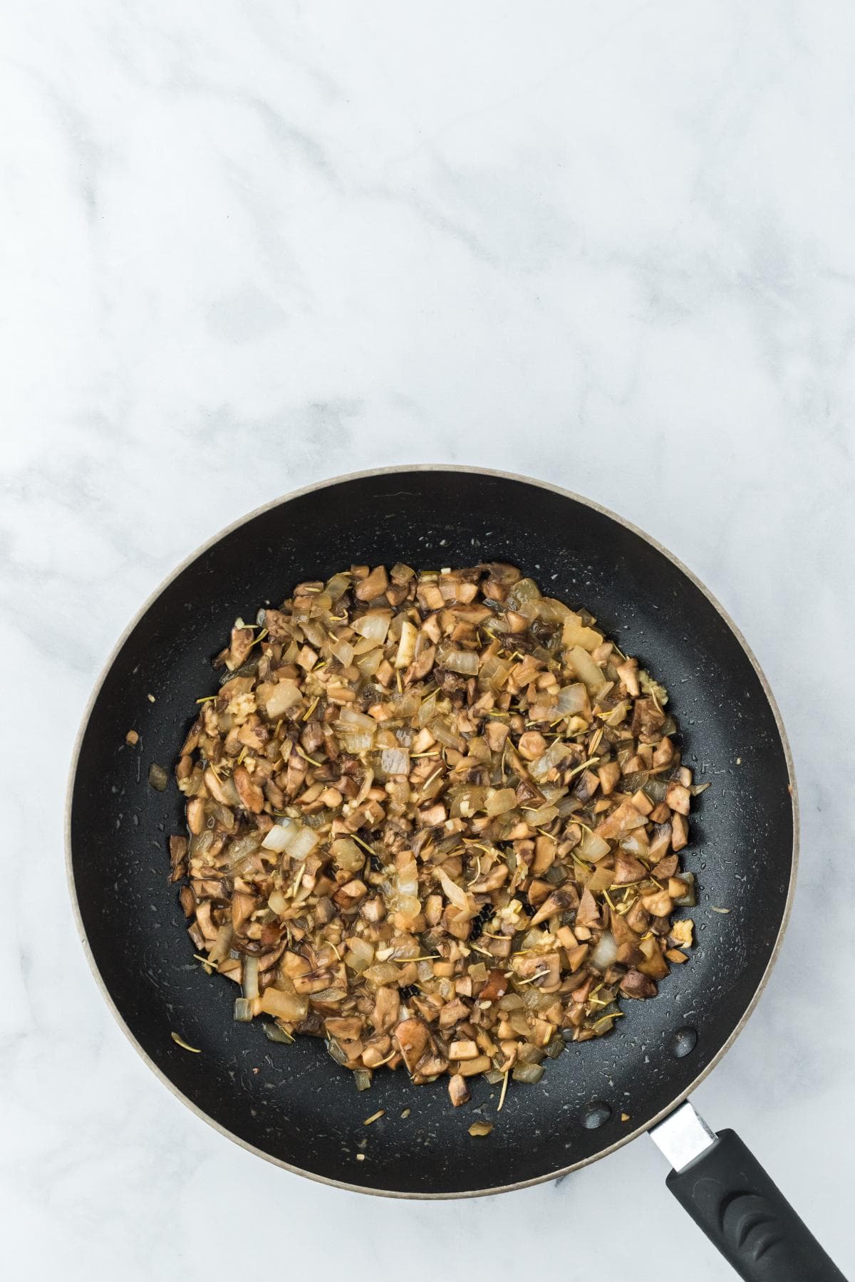 Sautéed mushroom and onion mixture cooked down in the skillet
