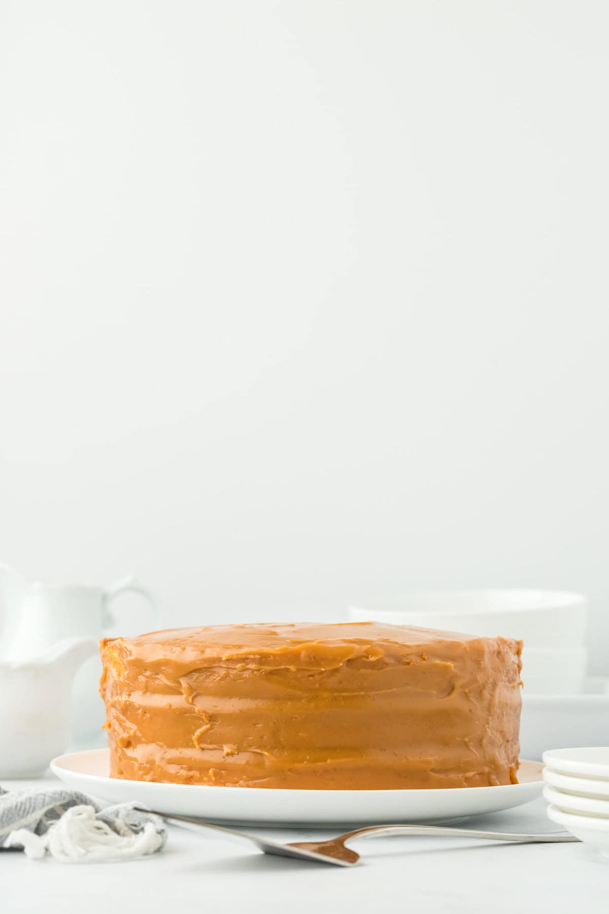 Caramel spread on layers of cake ready to serve