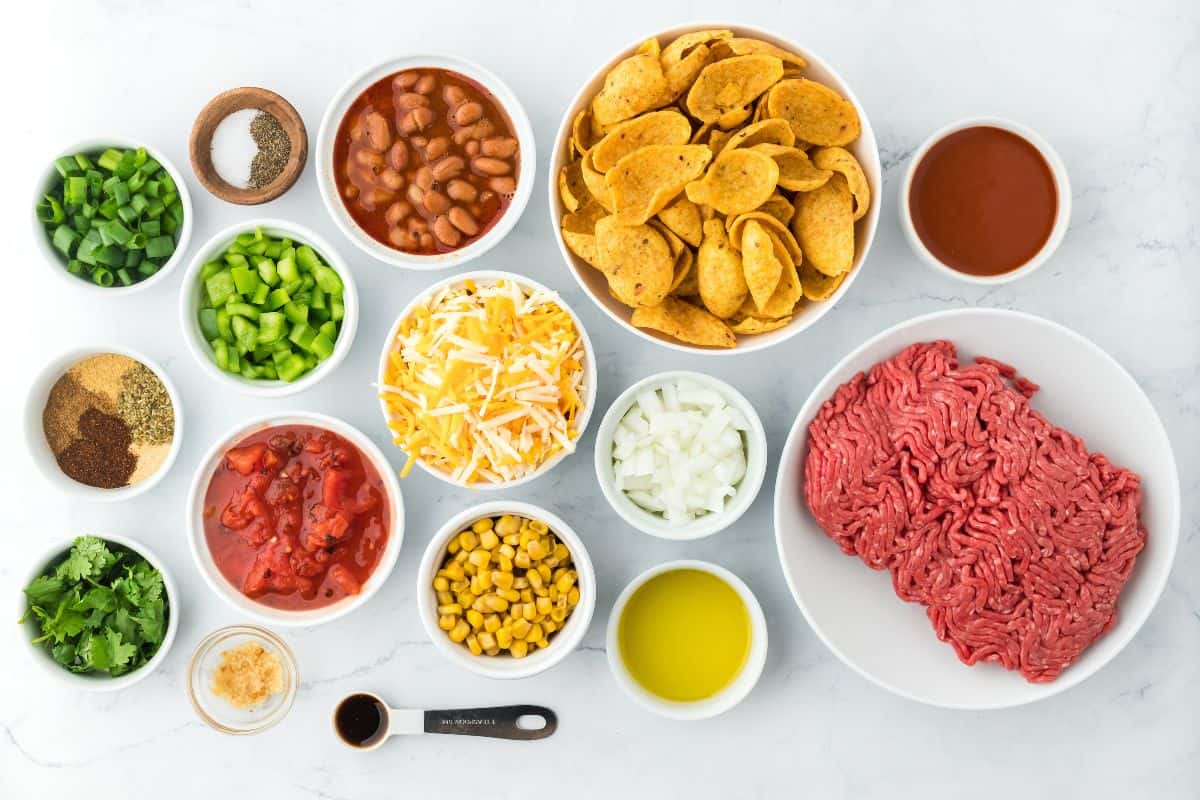 Overhead shot of ingredients to make frito pie on the counter before cooking
