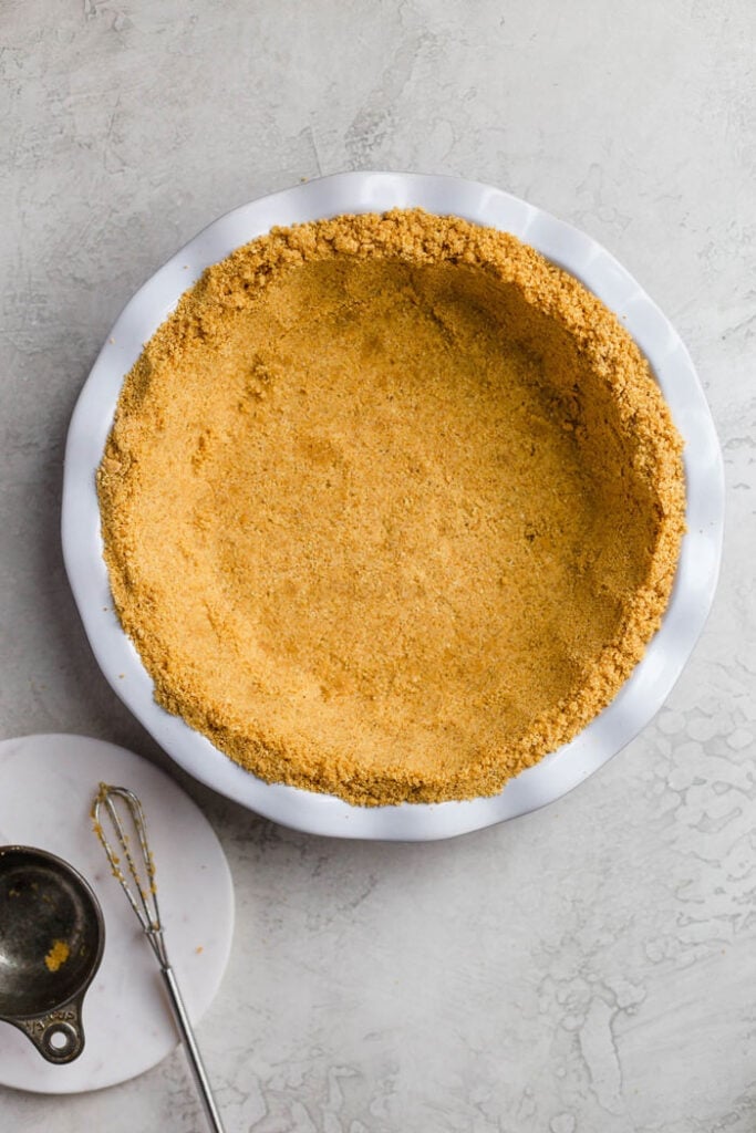 Press graham cracker crust on silver background