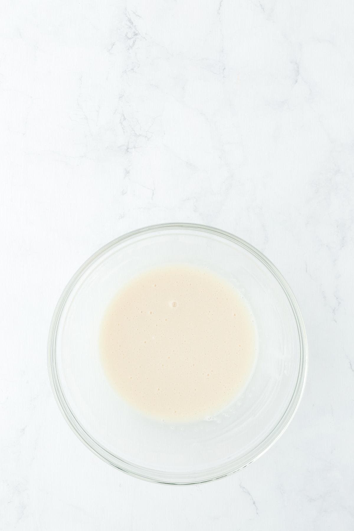 Vanilla glaze in bowl for topping