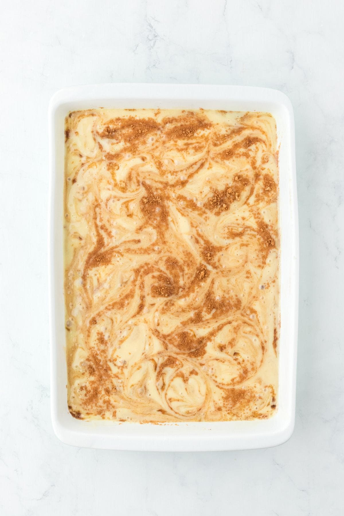 Swirled cinnamon sugar mixture in cake batter
