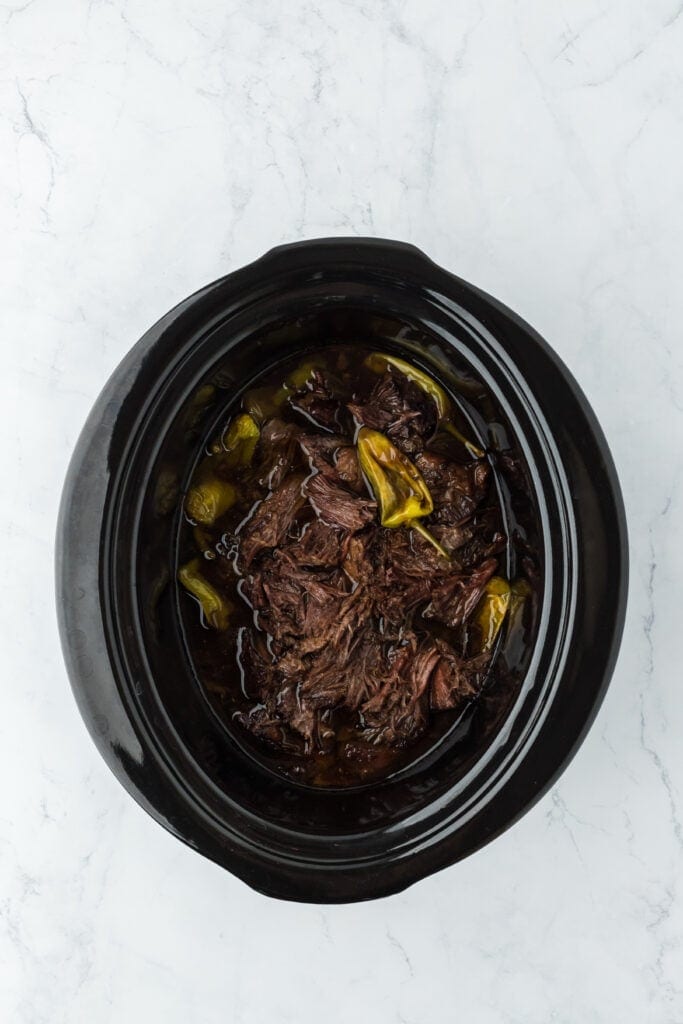 Shredded pot roast in a slow cooker