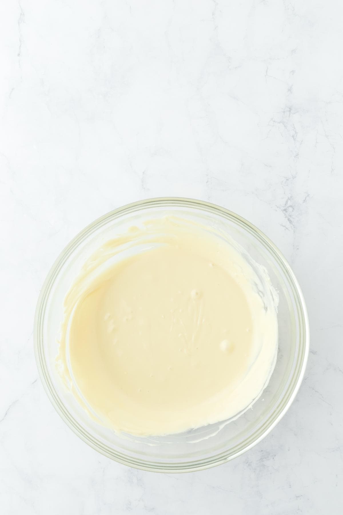 A bowl of melted white chocolate for the top layer of peppermint bark