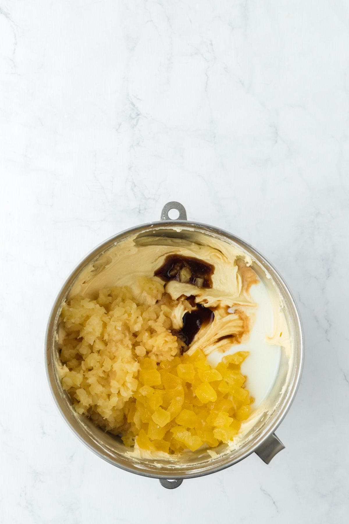 Cake batter with pineapple, vanilla, and buttermilk added