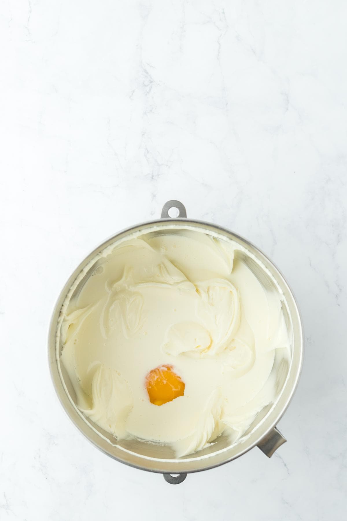 Smooth cream cheese filling with one egg just added in the center before mixing