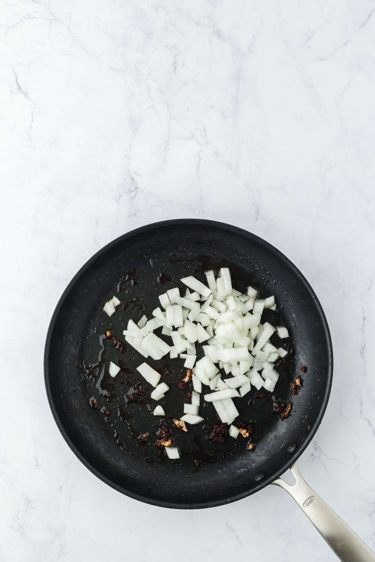 Onions added to a skillet